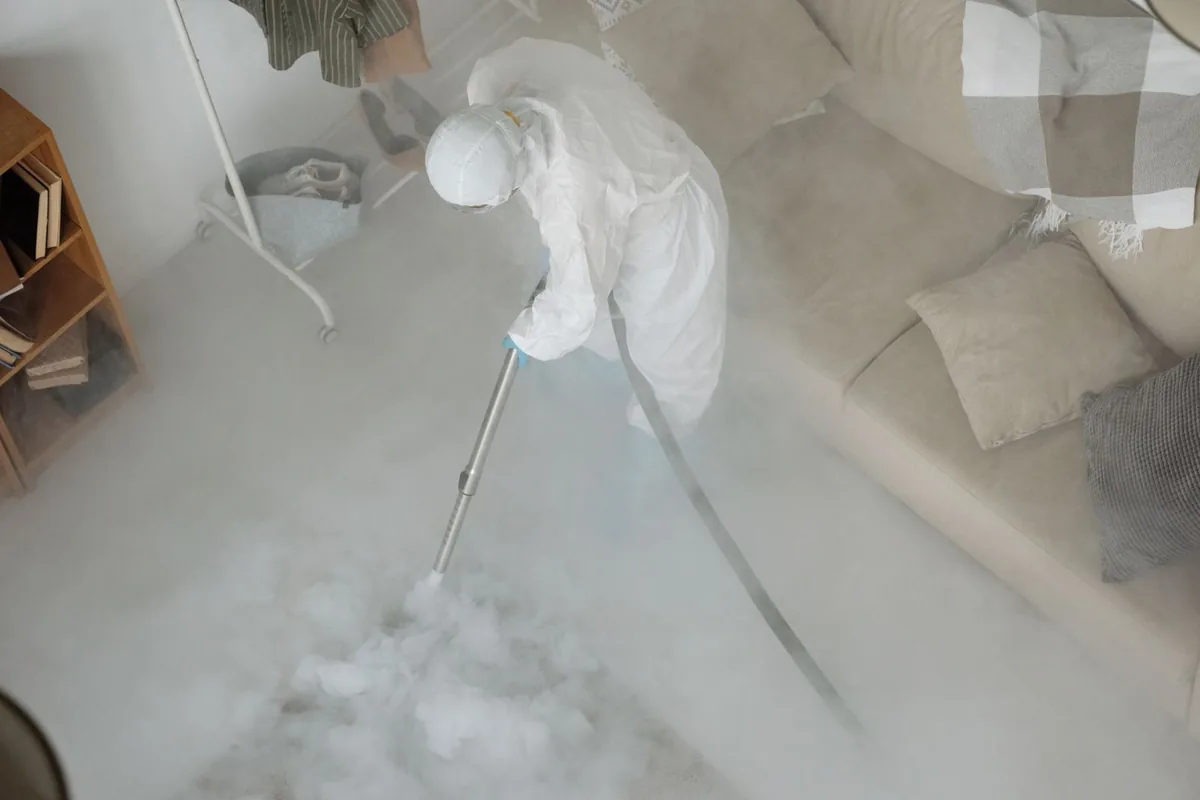 Biohazard cleanup technician in protective equipment, Pewaukee, WI